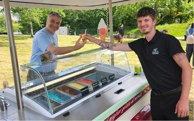 stock-photo-celebration-people-and-holidays-concept-happy-friends-at-party-under-golden-confetti-over-black-1814389034 1